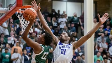 Richwoods' Marlon Herron goes to the basket against Harvey Thornton's Morez Johnson Jr. late in the