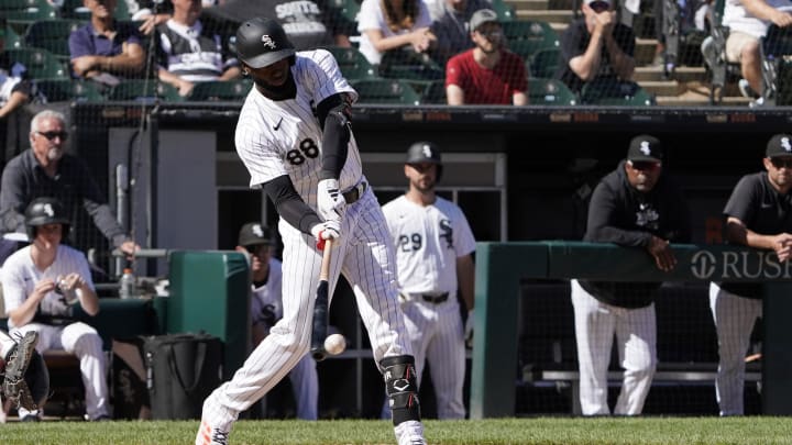 Jun 30, 2024; Chicago, Illinois, USA; Chicago White Sox outfielder Luis Robert Jr. (88) hits a single against the Colorado Rockies during the thirteenth inning at Guaranteed Rate Field. Mandatory Credit: David Banks-USA TODAY Sports