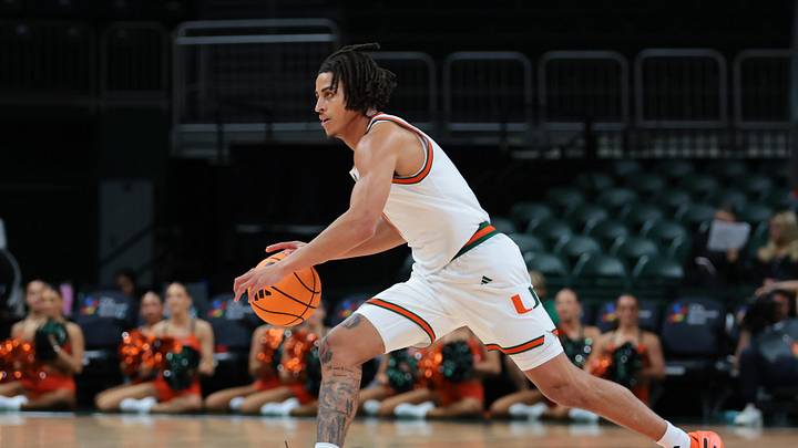 Nov 23, 2025; Coral Gables, Florida, USA; Miami Hurricanes guard Jordyn Kee (1) drives to the basket against the Delaware State Hornets during the second half at Watsco Center. Mandatory Credit: Sam Navarro-Imagn Images