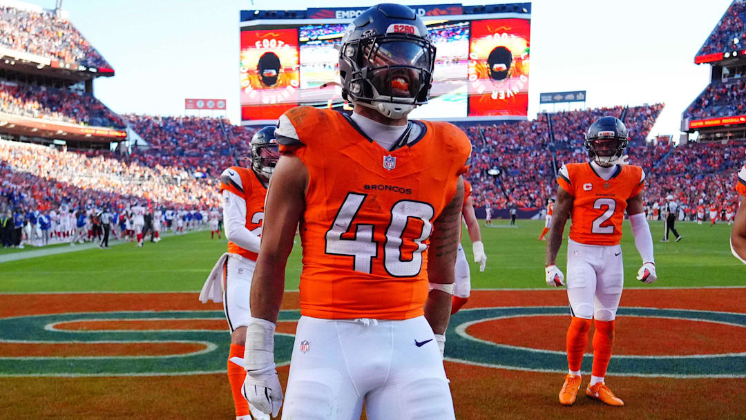 Oct 19, 2025; Denver, Colorado, USA; Denver Broncos linebacker Justin Strnad (40) celebrates after a touchdown during the second half against the New York Giants at Empower Field at Mile High. 