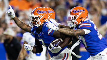 Oct 19, 2024; Gainesville, Florida, USA; Florida Gators defensive back Trikweze Bridges (7) runs with Florida Gators defensive back Dijon Johnson (27) after an interception against the Kentucky Wildcats during the first half at Ben Hill Griffin Stadium. Mandatory Credit: Matt Pendleton-Imagn Images