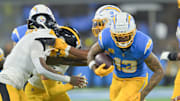 Nov 9, 2025; Inglewood, California, USA; Los Angeles Chargers wide receiver Keenan Allen (13) carries the ball after a reception against the Pittsburgh Steelers during the fourth quarter of the game at SoFi Stadium. Allen set a franchise record for reception with this catch. Mandatory Credit: Jayne Kamin-Oncea-Imagn Images