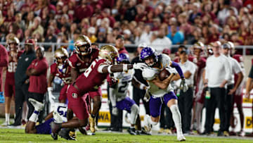 Nov 18, 2023; Tallahassee, Florida, USA; North Alabama Lions running back Parker Driggers (4) runs past Florida State Seminoles linebacker Omar Graham Jr. (36) during the first quarter at Doak S. Campbell Stadium. Mandatory Credit: Morgan Tencza-USA TODAY Sports