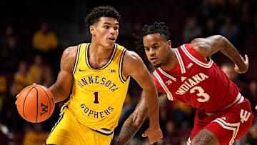 Dec 3, 2025; Minneapolis, Minnesota, USA; Minnesota Golden Gophers guard Isaac Asuma (1) works around Indiana Hoosiers guard Lamar Wilkerson (3) during the first half at Williams Arena. Mandatory Credit: Matt Krohn-Imagn Images