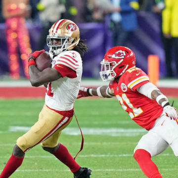 Feb 11, 2024; Paradise, Nevada, USA; San Francisco 49ers wide receiver Brandon Aiyuk (11) makes a catch against Kansas City Chiefs safety Mike Edwards (21) during overtime of Super Bowl LVIII at Allegiant Stadium. Mandatory Credit: Kyle Terada-USA TODAY Sports