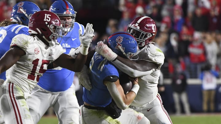 Nov 12, 2022; Oxford, Mississippi, USA;  Alabama Crimson Tide defensive lineman Byron Young (47) sacks Ole Miss Rebels quarterback Jaxson Dart (2) at Vaught-Hemingway Stadium. Alabama won 30-24. Gary Cosby Jr.-USA TODAY Sports