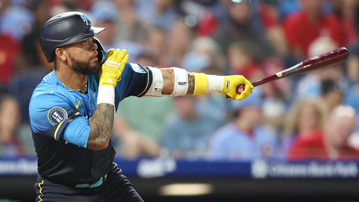 Sep 26, 2025; Philadelphia, Pennsylvania, USA; Philadelphia Phillies second base Edmundo Sosa (33) hits a home run against the Minnesota Twins during the fifth inning at Citizens Bank Park. 