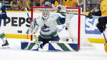 May 3, 2024; Nashville, Tennessee, USA; Vancouver Canucks goalkeeper Vancouver Canucks goalie Arturs Silovs (31) blocks the puck against the Nashville Predators during the third period in game six of the first round of the 2024 Stanley Cup Playoffs at Bridgestone Arena. Mandatory Credit: Steve Roberts-USA TODAY Sports