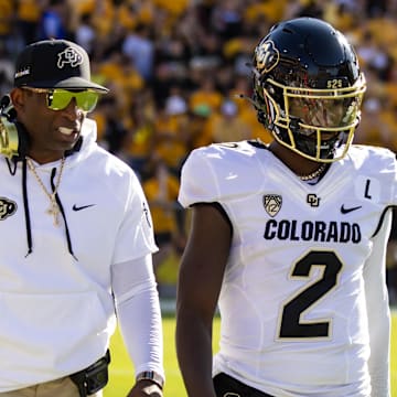 Colorado Buffaloes head coach Deion Sanders with son and quarterback Shedeur Sanders on Oct 7, 2023.