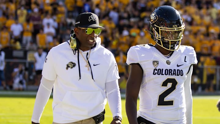 Colorado Buffaloes head coach Deion Sanders with son and quarterback Shedeur Sanders on Oct 7, 2023.