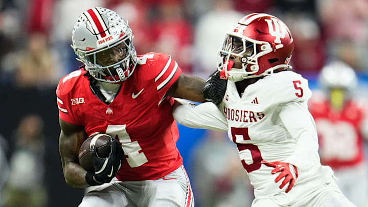 Ohio State Buckeyes wide receiver Jeremiah Smith (4) shakes off Indiana Hoosiers defensive back D'Angelo Ponds (5) during the Big Ten Conference championship game at Lucas Oil Stadium in Indianapolis on Dec. 6, 2025. Ohio State lost 13-10.