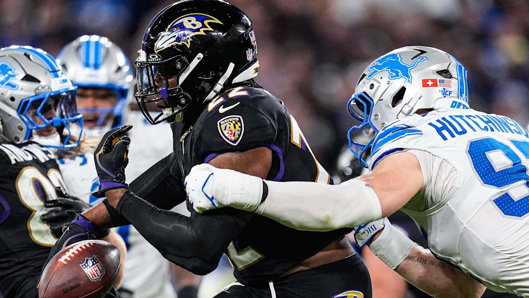 Detroit Lions defensive end Aidan Hutchinson (97) forces Baltimore Ravens running back Derrick Henry (22) to fumble during the second half at M&T Bank Stadium in Baltimore, Md. on Monday, Sept. 22, 2025.