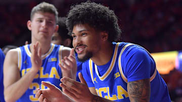 Feb 11, 2025; Champaign, Illinois, USA;  UCLA Bruins guard Christian Horry (7) gives teammates a hand during the second half against the Illinois Fighting Illini at State Farm Center. Mandatory Credit: Ron Johnson-Imagn Images