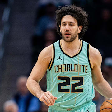 Jan 24, 2025; Charlotte, North Carolina, USA; Charlotte Hornets guard Vasilije Micic (22) brings the ball up court against the Portland Trail Blazers during the second quarter at Spectrum Center. Mandatory Credit: Scott Kinser-Imagn Images