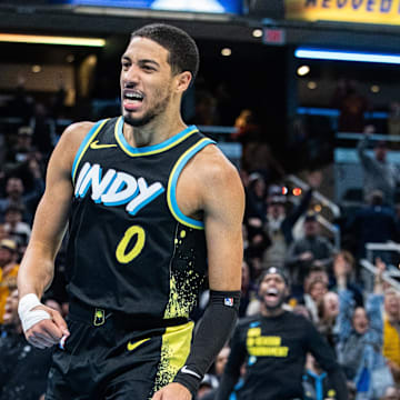 Nov 24, 2023; Indianapolis, Indiana, USA; Indiana Pacers guard Tyrese Haliburton (0) celebrates a made basket  in the second half against the Detroit Pistons at Gainbridge Fieldhouse. Mandatory Credit: Trevor Ruszkowski-Imagn Images