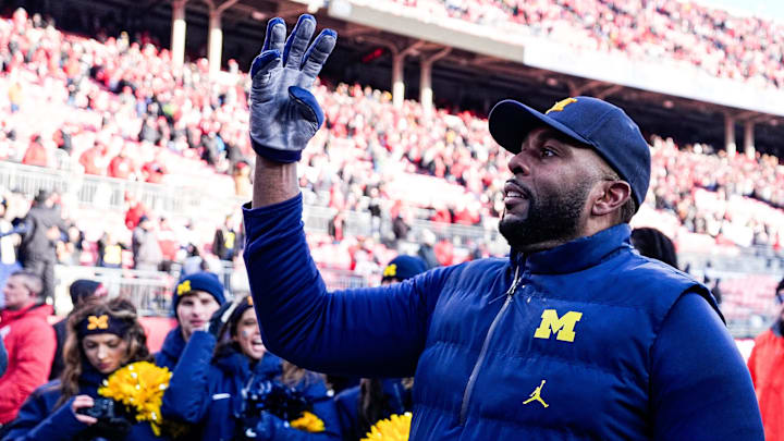 Michigan head coach Sherrone Moore uses a hand signal to celebrate the Wolverines' fourth straight win over Ohio State at Ohio Stadium in Columbus, Ohio on Saturday, Nov. 30, 2024.