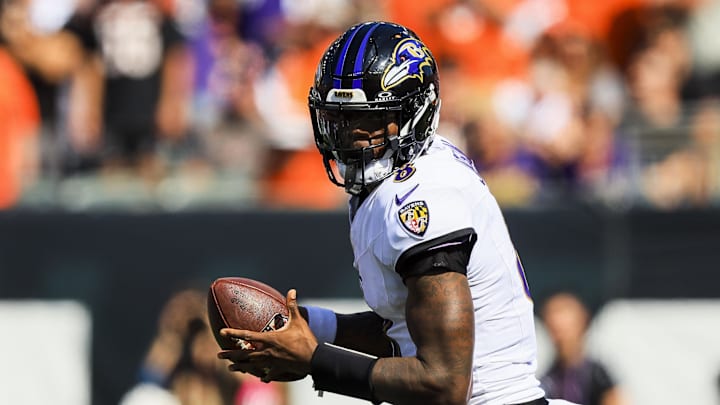 Oct 6, 2024; Cincinnati, Ohio, USA; Baltimore Ravens quarterback Lamar Jackson (8) runs with the ball against the Cincinnati Bengals in the first half at Paycor Stadium. Mandatory Credit: Katie Stratman-Imagn Images