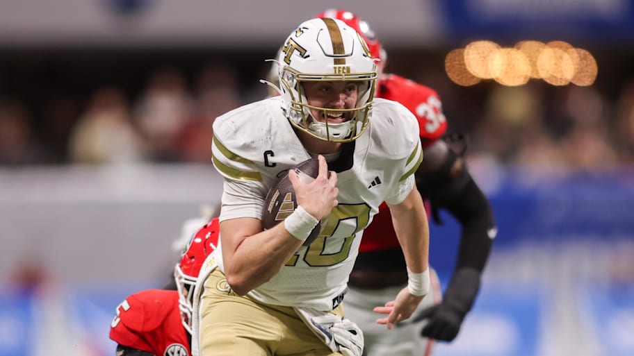 Haynes King runs the ball for Georgia Tech against Georgia.