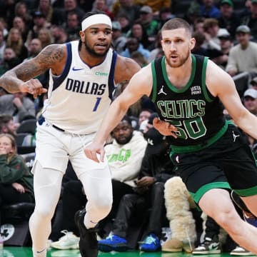 Mar 1, 2024; Boston, Massachusetts, USA; Boston Celtics guard Svi Mykhailiuk (50) drives the ball against Dallas Mavericks guard Jaden Hardy (1) in the second half at TD Garden. Mandatory Credit: David Butler II-USA TODAY Sports