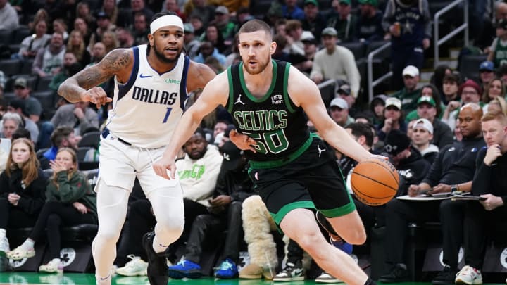 Mar 1, 2024; Boston, Massachusetts, USA; Boston Celtics guard Svi Mykhailiuk (50) drives the ball against Dallas Mavericks guard Jaden Hardy (1) in the second half at TD Garden. Mandatory Credit: David Butler II-USA TODAY Sports