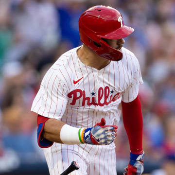 Jul 9, 2024; Philadelphia, Pennsylvania, USA; Philadelphia Phillies designated hitter Kyle Schwarber (12) hits a 2 RBI single during the second inning against the Los Angeles Dodgers at Citizens Bank Park.