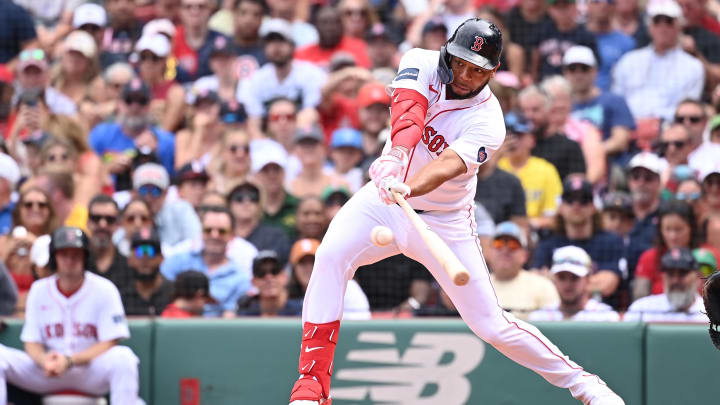 Aug 11, 2024; Boston, Massachusetts, USA; Boston Red Sox first baseman Dominic Smith (2) hits a single against the Houston Astros during the fifth inning at Fenway Park. Mandatory Credit: Eric Canha-USA TODAY Sports