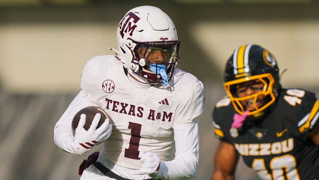 Nov 8, 2025; Columbia, Missouri, USA; Texas A&M Aggies wide receiver Mario Craver (1) runs with the ball during the first half against the Missouri Tigers at Faurot Field at Memorial Stadium. Mandatory Credit: Jay Biggerstaff-Imagn Images
