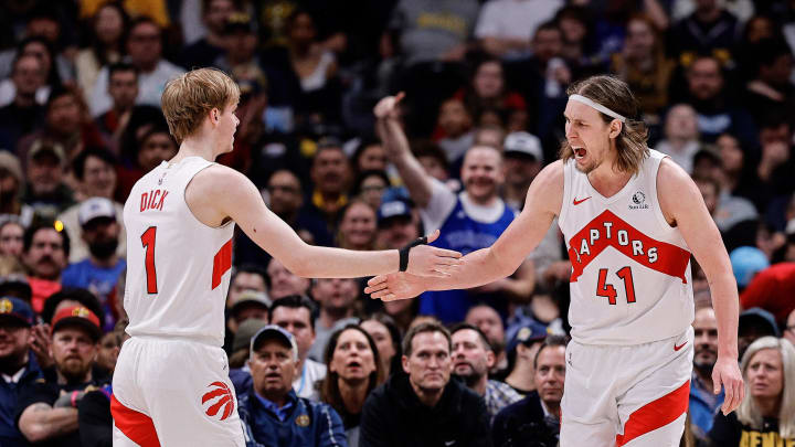 Mar 11, 2024; Denver, Colorado, USA; Toronto Raptors forward Kelly Olynyk (41) reacts with guard Gradey Dick (1) in the third quarter against the Denver Nuggets at Ball Arena. Mandatory Credit: Isaiah J. Downing-USA TODAY Sports