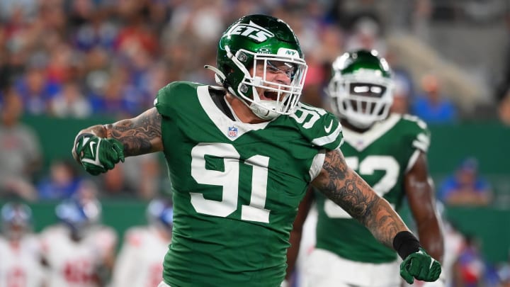 Aug 24, 2024; East Rutherford, New Jersey, USA; New York Jets defensive end Braiden McGregor (91) reacts to a defesive play against the New York Giants during the first half at MetLife Stadium. 