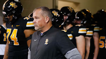 Southeast Polk head coach Brad Zelenovich waits with his players before the Class 5A playoff championships on Friday, Nov. 18, 2022, at the UNI-Dome in Cedar Falls. The Rams defeated the Tigers, 49-14.