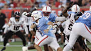 Oct 4, 2025; Houston, Texas, USA; Houston Cougars quarterback Conner Weigman (1) rushes against the Texas Tech Raiders in the first half at TDECU Stadium. Mandatory Credit: Thomas Shea-Imagn Images
