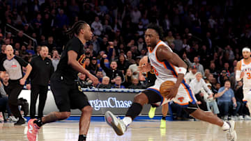 New York Knicks forward OG Anunoby drives to the basket against Cleveland Cavaliers guard Darius Garland. Mandatory Credit: Brad Penner-Imagn Images