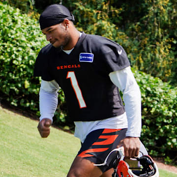 Cincinnati Bengals wide receiver Ja'Marr Chase (1) walks onto the practice field, Wednesday, Sept. 4, 2024, in Cincinnati.