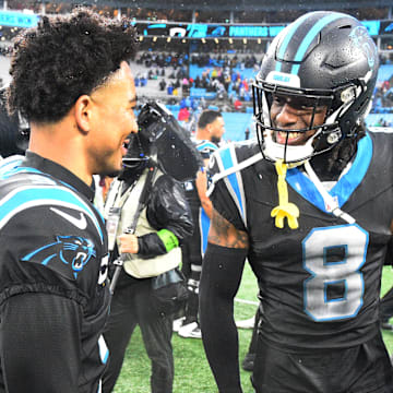 Dec 17, 2023; Charlotte, North Carolina, USA; Carolina Panthers quarterback Bryce Young (9) with cornerback Jaycee Horn (8) after the game at Bank of America Stadium.