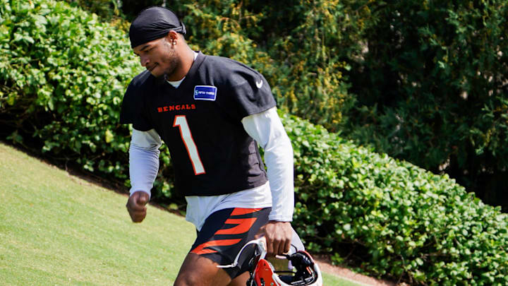 Cincinnati Bengals wide receiver Ja'Marr Chase (1) walks onto the practice field, Wednesday, Sept. 4, 2024, in Cincinnati.