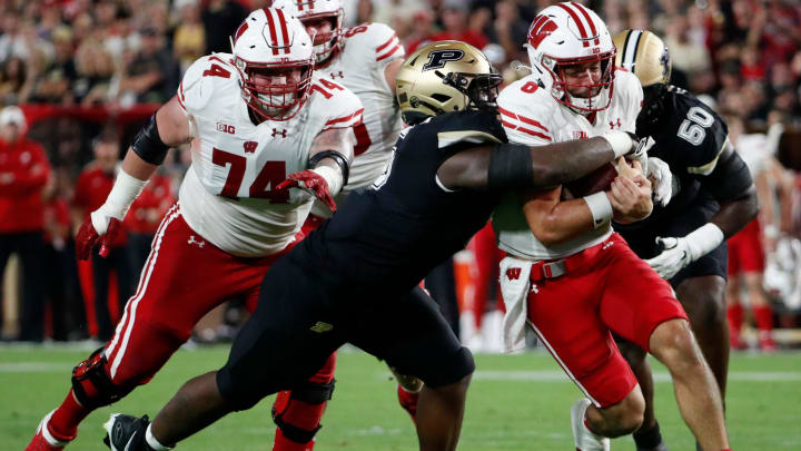 Purdue's Nic Scourton Wisconsin QB Tanner Mordecai. Scourton, now with Texas A&M, has been mock-drafted to the Bears.