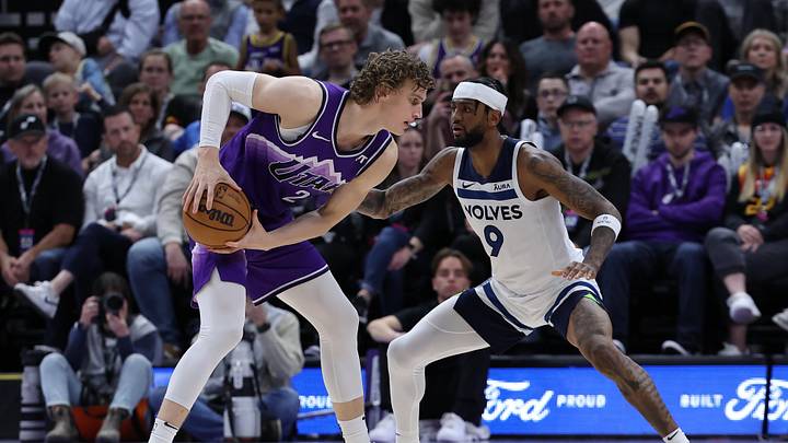 Mar 18, 2024; Salt Lake City, Utah, USA; Utah Jazz forward Lauri Markkanen (23) looks to move the ball against Minnesota Timberwolves guard Nickeil Alexander-Walker (9) during the fourth quarter at Delta Center. Mandatory Credit: Rob Gray-Imagn Images