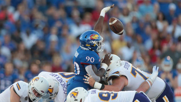 Kansas junior defensive lineman Jereme Robinson (90) blocks a punt by Tennessee Tech during the first half of Friday's game a