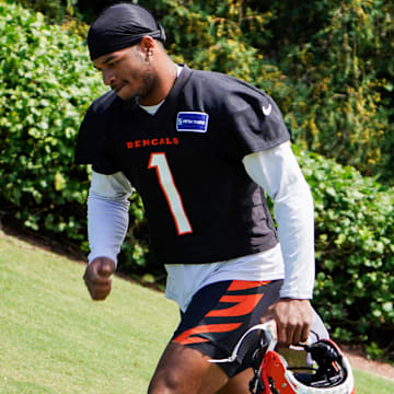 Cincinnati Bengals wide receiver Ja'Marr Chase (1) walks onto the practice field, Wednesday, Sept. 4, 2024, in Cincinnati.