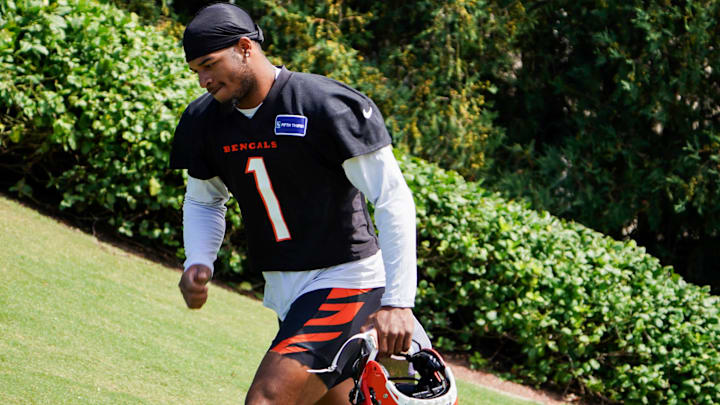 Cincinnati Bengals wide receiver Ja'Marr Chase (1) walks onto the practice field, Wednesday, Sept. 4, 2024, in Cincinnati.