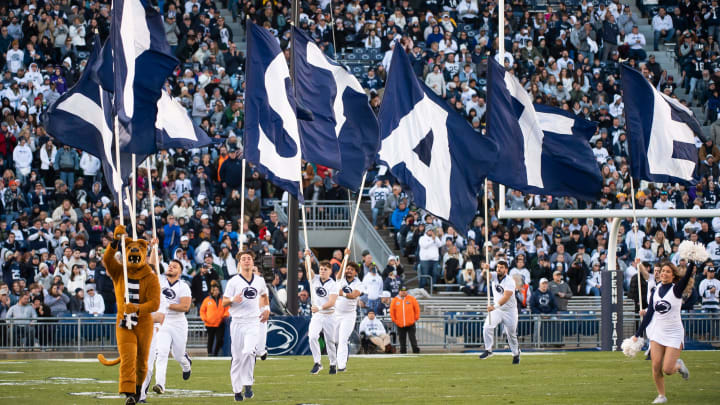 The Penn State Nittany Lion mascot and cheerleaders run across the field before the start of a game against Michigan State at Beaver Stadium. 