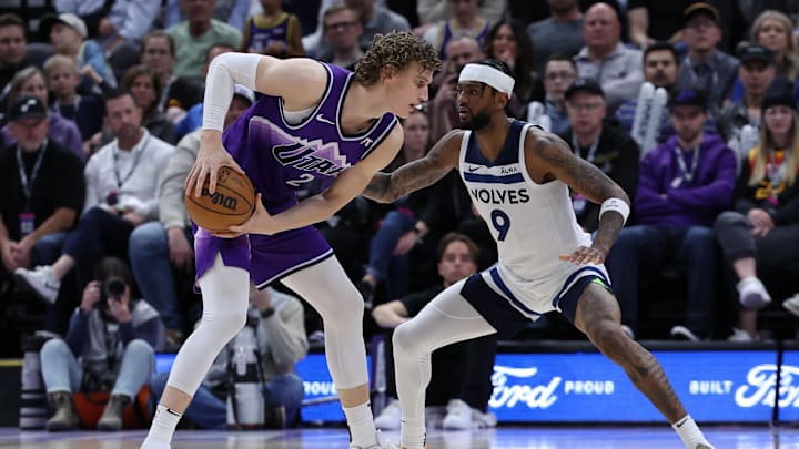 Mar 18, 2024; Salt Lake City, Utah, USA; Utah Jazz forward Lauri Markkanen (23) looks to move the ball against Minnesota Timberwolves guard Nickeil Alexander-Walker (9) during the fourth quarter at Delta Center. Mandatory Credit: Rob Gray-Imagn Images