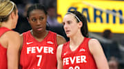 Jun 19, 2025; San Francisco, California, USA; Indiana Fever guard Caitlin Clark (22) talks to guard Lexie Hull (left) and forward Aliyah Boston (7) during the third quarter against the Golden State Valkyries at Chase Center. Mandatory Credit: Darren Yamashita-Imagn Images