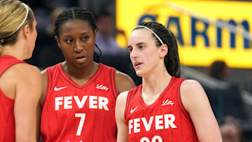 Jun 19, 2025; San Francisco, California, USA; Indiana Fever guard Caitlin Clark (22) talks to guard Lexie Hull (left) and forward Aliyah Boston (7) during the third quarter against the Golden State Valkyries at Chase Center. Mandatory Credit: Darren Yamashita-Imagn Images