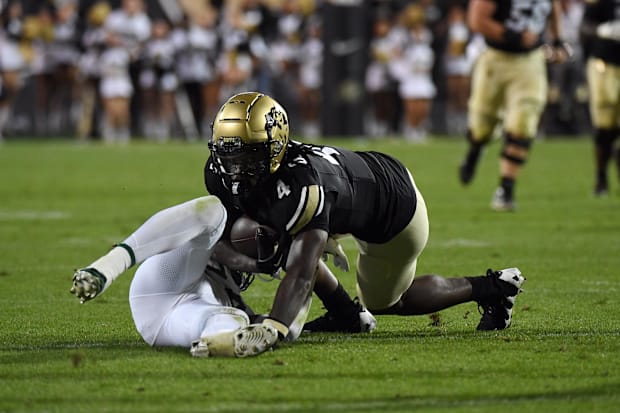 Sep 21, 2024; Boulder, Colorado, USA; Colorado Buffaloes wide receiver Omarion Miller (4) stays on his feet to score after a 