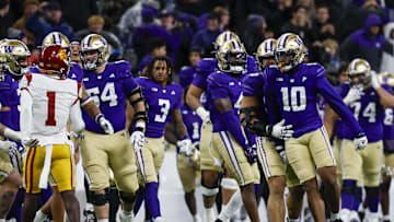 Nov 2, 2024; Seattle, Washington, USA; Washington Huskies edge Lance Holtzclaw (10) celebrates following a fourth down turnover by the USC Trojans during the fourth quarter at Alaska Airlines Field at Husky Stadium. Mandatory Credit: Joe Nicholson-Imagn Images