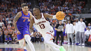 Feb 8, 2025; Auburn, Alabama, USA;  Auburn Tigers guard Miles Kelly (13) runs a play against the Florida Gators during the second half at Neville Arena. Mandatory Credit: John Reed-Imagn Images