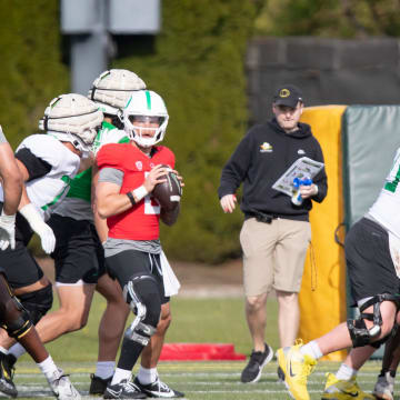 Oregon quarterback Dillon Gabriel looks to pass during practice with the Ducks Thursday, April 11, 2024, at the Hatfield-Dowlin Complex in Eugene, Ore.
