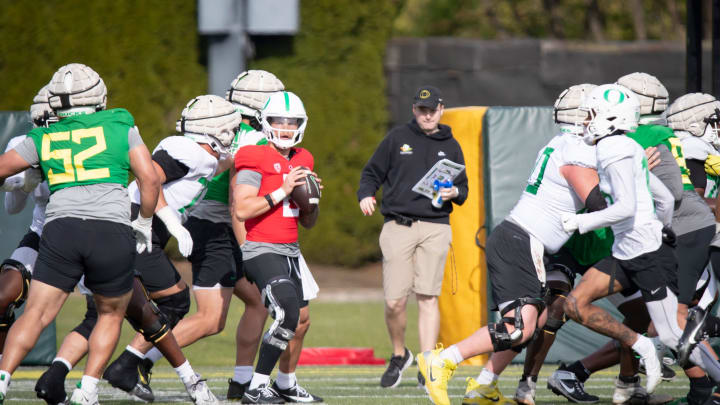 Oregon quarterback Dillon Gabriel looks to pass during practice with the Ducks Thursday, April 11, 2024, at the Hatfield-Dowlin Complex in Eugene, Ore.