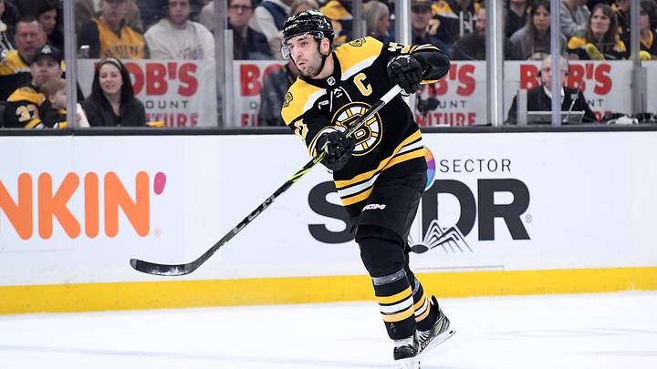 Feb 18, 2023; Boston, Massachusetts, USA; Boston Bruins center Patrice Bergeron (37) passes the puck during the first period against the New York Islanders at TD Garden. Mandatory Credit: Bob DeChiara-Imagn Images Feb 18, 2023; Boston, Massachusetts, USA; Boston Bruins center Patrice Bergeron (37) passes the puck during the first period against the New York Islanders at TD Garden. Mandatory Credit: Bob DeChiara-Imagn Images